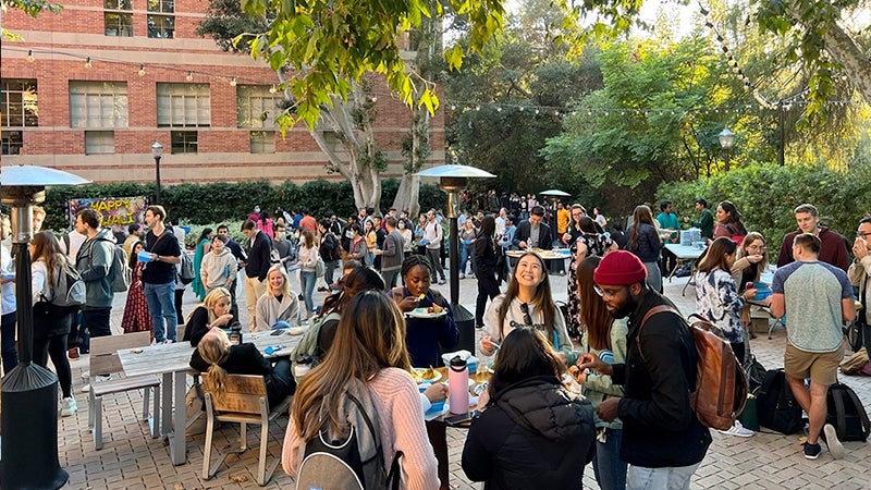 Students gather outside of the UCLA Anderson complex