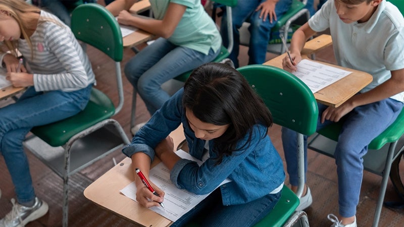 Students sitting at a desk in school