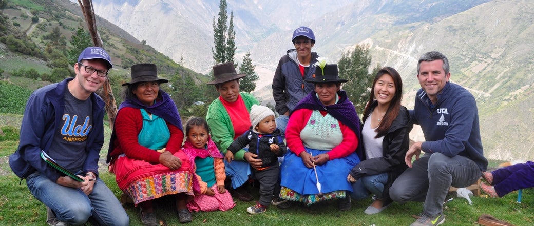 Students with Peruvian non-profit on a hill