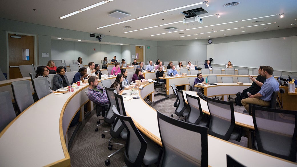 Students in class lecture at a large classroom space at UCLA Anderson