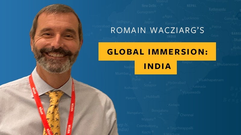 Photo of Professor Romain Wacziarg superimposed over a map of India